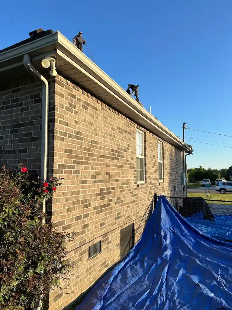 two roofers on roof